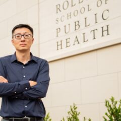 Yang Liu standing in front of the Rollins School of Public Health