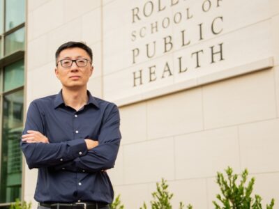 Yang Liu standing in front of the Rollins School of Public Health